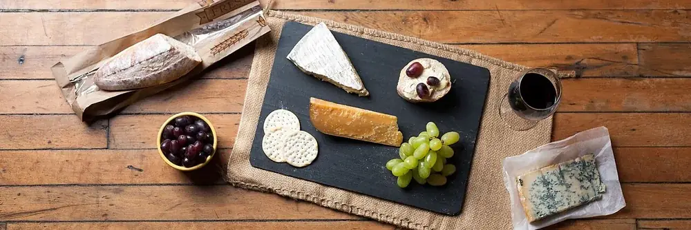 Wine and a platter of cheeses for pairing